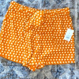 Orange and white shorts size XL $10